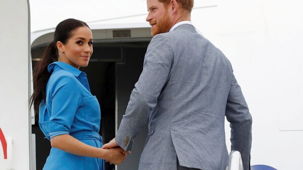 Britain's Prince Harry and Meghan, Duchess of Sussex look on before departing from Fua'amotu International Airport in Tonga, 26 October 2018 - Sputnik International