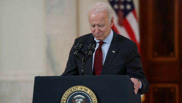 US President Joe Biden concludes his remarks in honor of the 500,000 US deaths from the coronavirus disease (COVID-19), in the Cross Hall at the White House in Washington, U.S., February 22, 2021 - Sputnik International