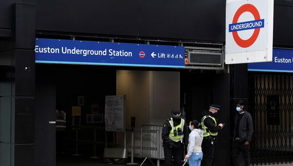 British Transport Police officers check on travellers as they arrive at Euston rail station during lockdown restrictions, amid the spread of the coronavirus disease (COVID-19) pandemic, London, Britain, January 31, 2021.  - Sputnik International