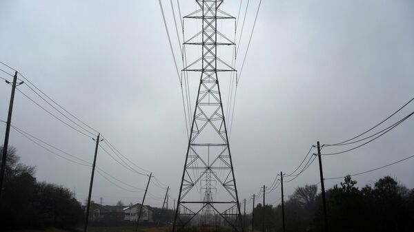Power lines are seen after winter weather caused electricity blackouts in Houston, Texas, U.S. February 17, 2021 - Sputnik International