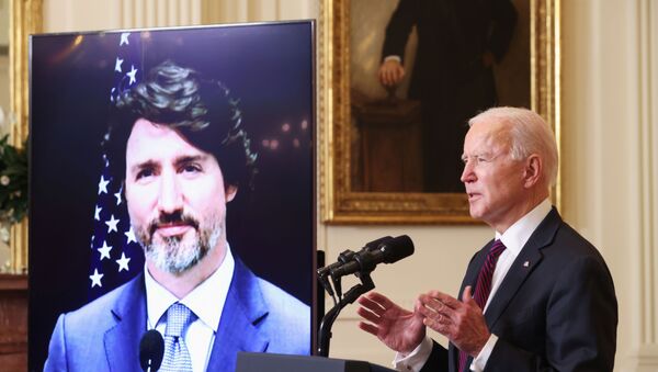U.S. President Joe Biden and Canada’s Prime Minister Justin Trudeau, appearing via video conference call, give closing remarks at the end of their virtual bilateral meeting from the White House in Washington, U.S. February 23, 2021 - Sputnik International