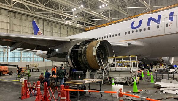 The damaged starboard engine of United Airlines flight 328, a Boeing 777-200, is seen following a Feb. 20 engine failure incident, in a hangar at Denver International Airport in Denver, Colorado, U.S. February 22, 2021 - Sputnik International