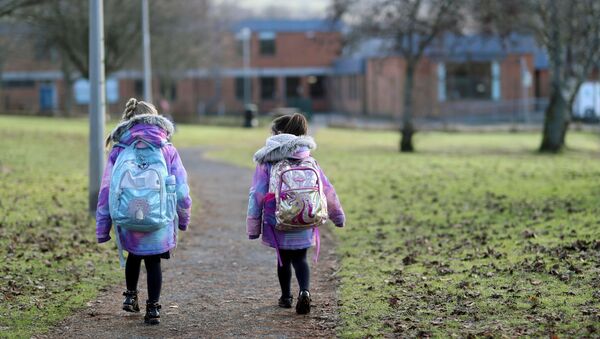 Pupils walk to Pitlochry High School on the first day back following the easing of the coronavirus disease (COVID-19) restrictions, in Pitlochry, Scotland, Britain, February 22, 2021 - Sputnik International