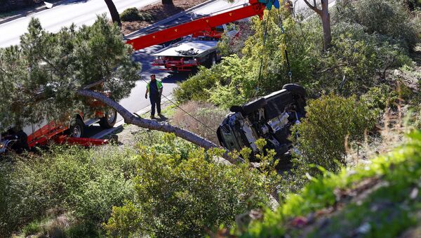 The overturned car of Tiger Woods is seen after he was involved in a car crash, near Los Angeles, California, U.S., February 23, 2021. REUTERS/Mario Anzuoni - Sputnik International