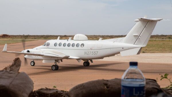 A Beechcraft King Air, heavily modified for spy missions, spotted at Baledogle Military Airfield in Somalia in late 2020 or early 2021. The plane's civil registration number doesn't belong to any known aircraft. After The War Zone published its story on February 24, 2021, the Pentagon seemingly removed the image from its public database. - Sputnik International