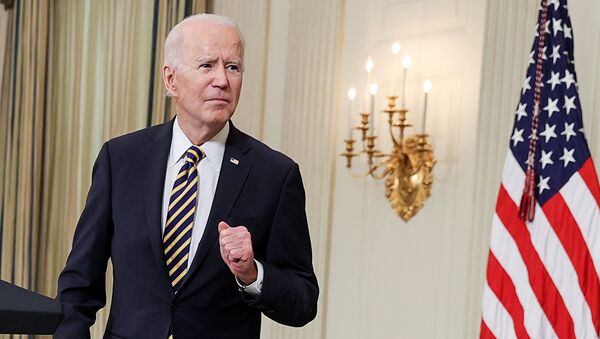 U.S. President Joe Biden listens to a question after delivering remarks and prior to signing an executive order, aimed at addressing a global semiconductor chip shortage, in the State Dining Room at the White House in Washington, U.S., February 24, 2021 - Sputnik International
