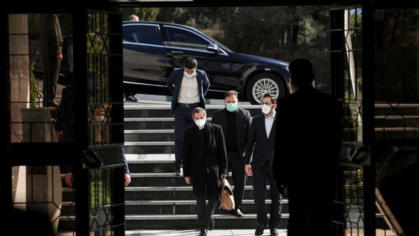 International Atomic Energy Agency (IAEA) Director General Rafael Grossi walks during a meeting with the head of Iran's Atomic Energy Organisation Ali-Akbar Salehi, in Tehran, Iran, 21 February 2021 - Sputnik International