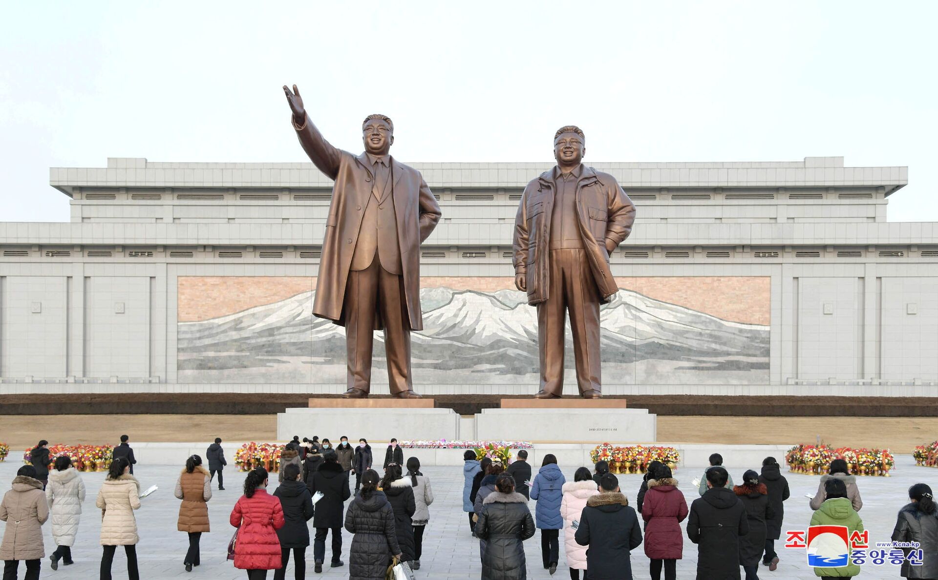 People lay floral tributes in front of the bronze statues of the late leaders Kim Il Sung and his son Kim Jong Il to commemorate the Day of the Shining Star, the birth anniversary of Kim Jong Il, at the Mansudae Grand Monument in Pyongyang, North Korea in this undated photo released by North Korea's Korean Central News Agency (KCNA) on February 17, 2021. - Sputnik International, 1920, 07.09.2021