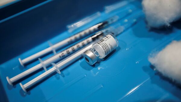 Syringes and an empty vial of a vaccine against the coronavirus disease (COVID-19) are pictured in the Winding Wheel Theatre, Chesterfield, Britain - Sputnik International