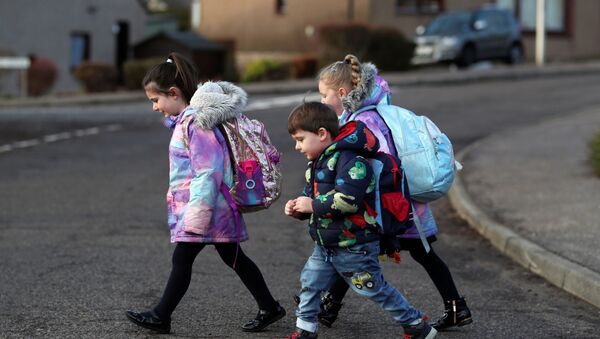 Pupils walk to Pitlochry High School on the first day back following the easing of the coronavirus disease (COVID-19) restrictions, in Pitlochry, Scotland, Britain, February 22, 2021. - Sputnik International