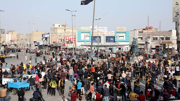 Iraqi demonstrators take part in ongoing anti-government protests in Nassiriya, Iraq January 29, 2021. Picture taken January 29, 2021  - Sputnik International