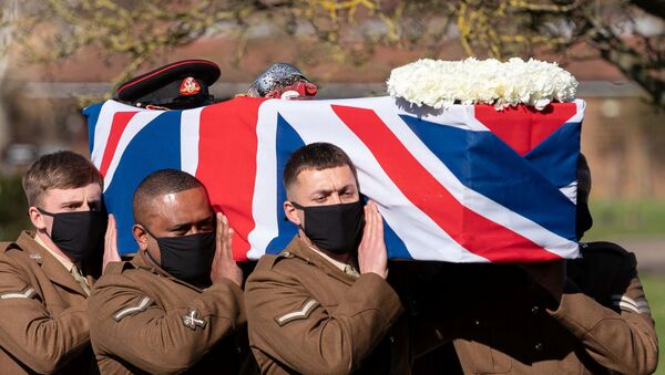 The coffin of Captain Sir Tom Moore is carried by members of the Armed Forces during his funeral at Bedford Crematorium, amid the coronavirus disease (COVID-19) outbreak, in Bedford, Britain February 27, 2021. - Sputnik International