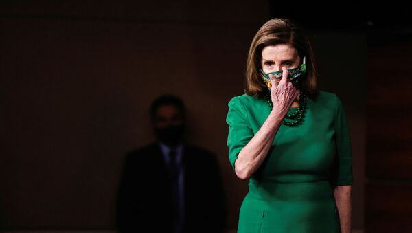 U.S. Speaker of the House Nancy Pelosi arrives for a news conference on the day the House of Representatives is expected to vote on legislation to provide $1.9 trillion in new coronavirus relief at the U.S. Capitol in Washington, U.S., February 26, 2021 - Sputnik International