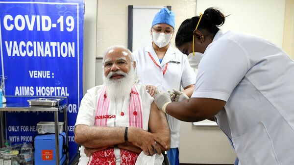 India's Prime Minister Narendra Modi receives a dose of COVAXIN, a coronavirus disease (COVID-19) vaccine developed by India's Bharat Biotech and the state-run Indian Council of Medical Research, at All India Institute of Medical Sciences (AIIMS) hospital in New Delhi, India, March 1, 2021 - Sputnik International