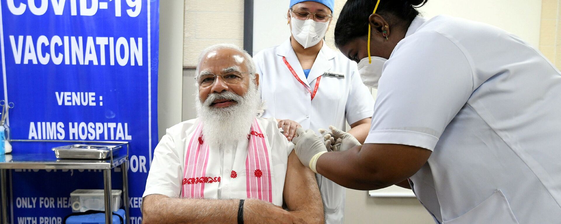 India's Prime Minister Narendra Modi receives a dose of COVAXIN, a coronavirus disease (COVID-19) vaccine developed by India's Bharat Biotech and the state-run Indian Council of Medical Research, at All India Institute of Medical Sciences (AIIMS) hospital in New Delhi, India, March 1, 2021 - Sputnik International, 1920