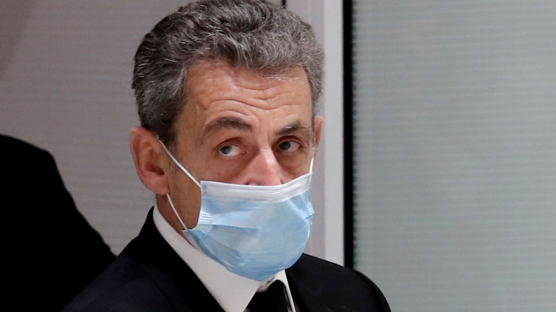 Former French President Nicolas Sarkozy leaves the courtroom during his trial on charges of corruption and influence peddling, at Paris courthouse, France, December 7, 2020. REUTERS/Benoit Tessier/File Photo - Sputnik International, 1920, 01.03.2021