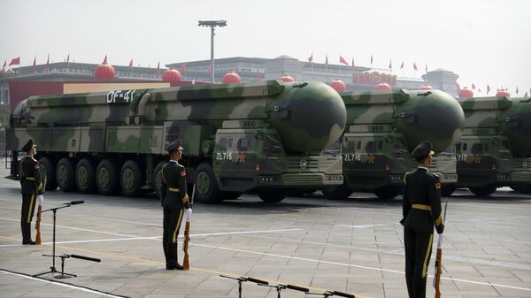 Chinese military vehicles carrying DF-41 ballistic missiles roll during a parade to commemorate the 70th anniversary of the founding of Communist China in Beijing, Tuesday, Oct. 1, 2019 - Sputnik International