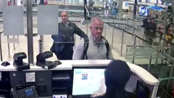 This Dec. 30, 2019 image from security camera video shows Michael L. Taylor, center, and George-Antoine Zayek at passport control at Istanbul Airport in Turkey. The U.S. State Department has agreed to turn over to Japan Taylor and his son Peter Taylor, who are accused of smuggling former Nissan Motor Co. Chairman Carlos Ghosn out of the country while he was awaiting trial, the men's lawyers said in legal filing on Thursday, Oct. 29, 2020 - Sputnik International