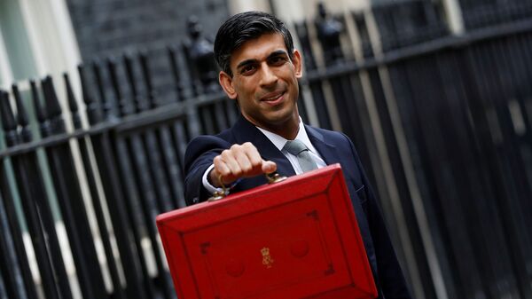 FILE PHOTO: Britain's Chancellor of the Exchequer Rishi Sunak holds the budget box outside his office in Downing Street in London - Sputnik International