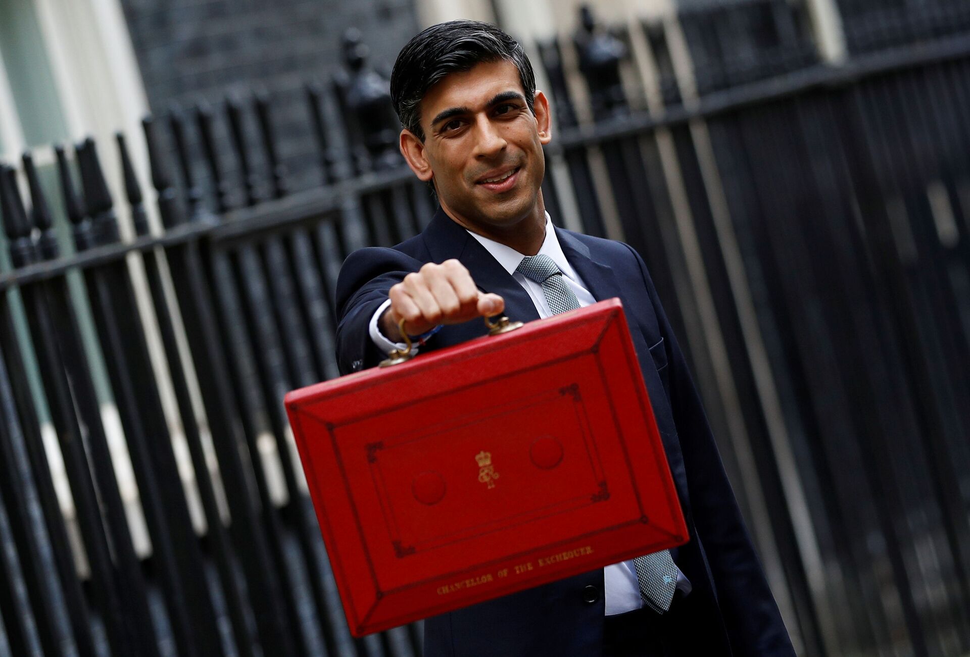 FILE PHOTO: Britain's Chancellor of the Exchequer Rishi Sunak holds the budget box outside his office in Downing Street in London - Sputnik International, 1920, 07.09.2021
