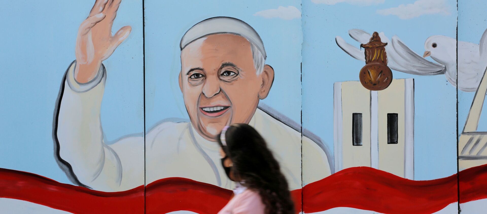 A mural of Pope Franci is seen on the wall of a church upon his upcoming visit to Iraq, in Baghdad. - Sputnik International, 1920, 02.03.2021