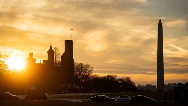 The Washington Monument and the Smithsonian Castle, as the sun sets in Washington, U.S., February 21, 2021. - Sputnik International