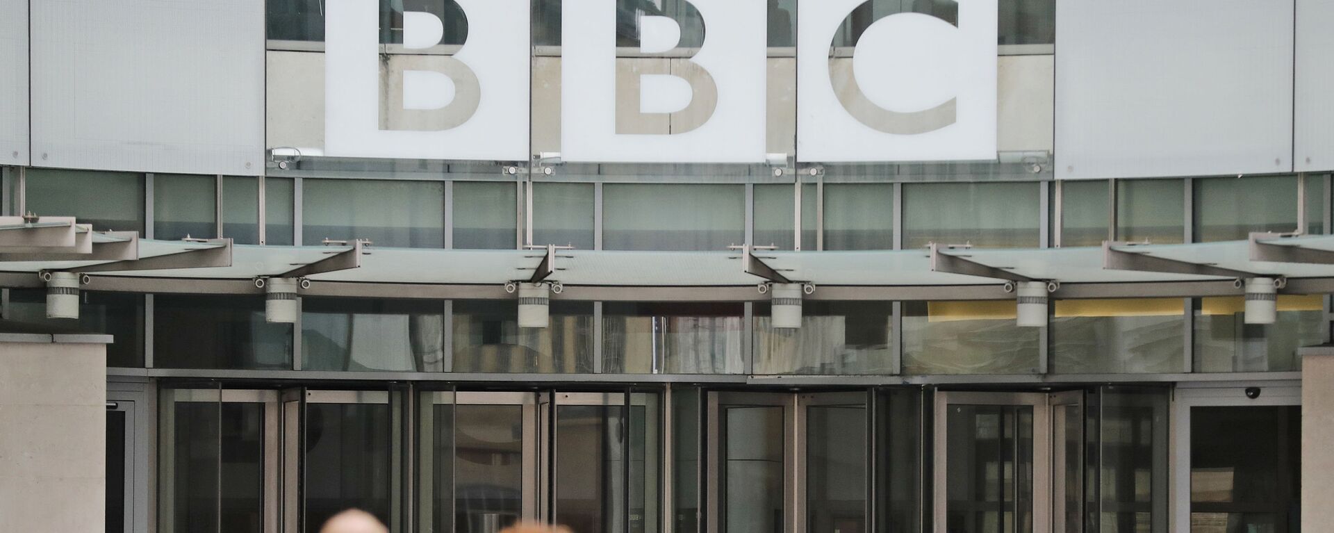 In this file photo dated Wednesday, July 19, 2017, an entrance to the headquarters of the publicly funded BBC in London.  Britain’s government announced Wednesday Feb. 5, 2020, that it is considering a change in the way the nation's public broadcaster, the BBC is funded - Sputnik International, 1920, 21.05.2021