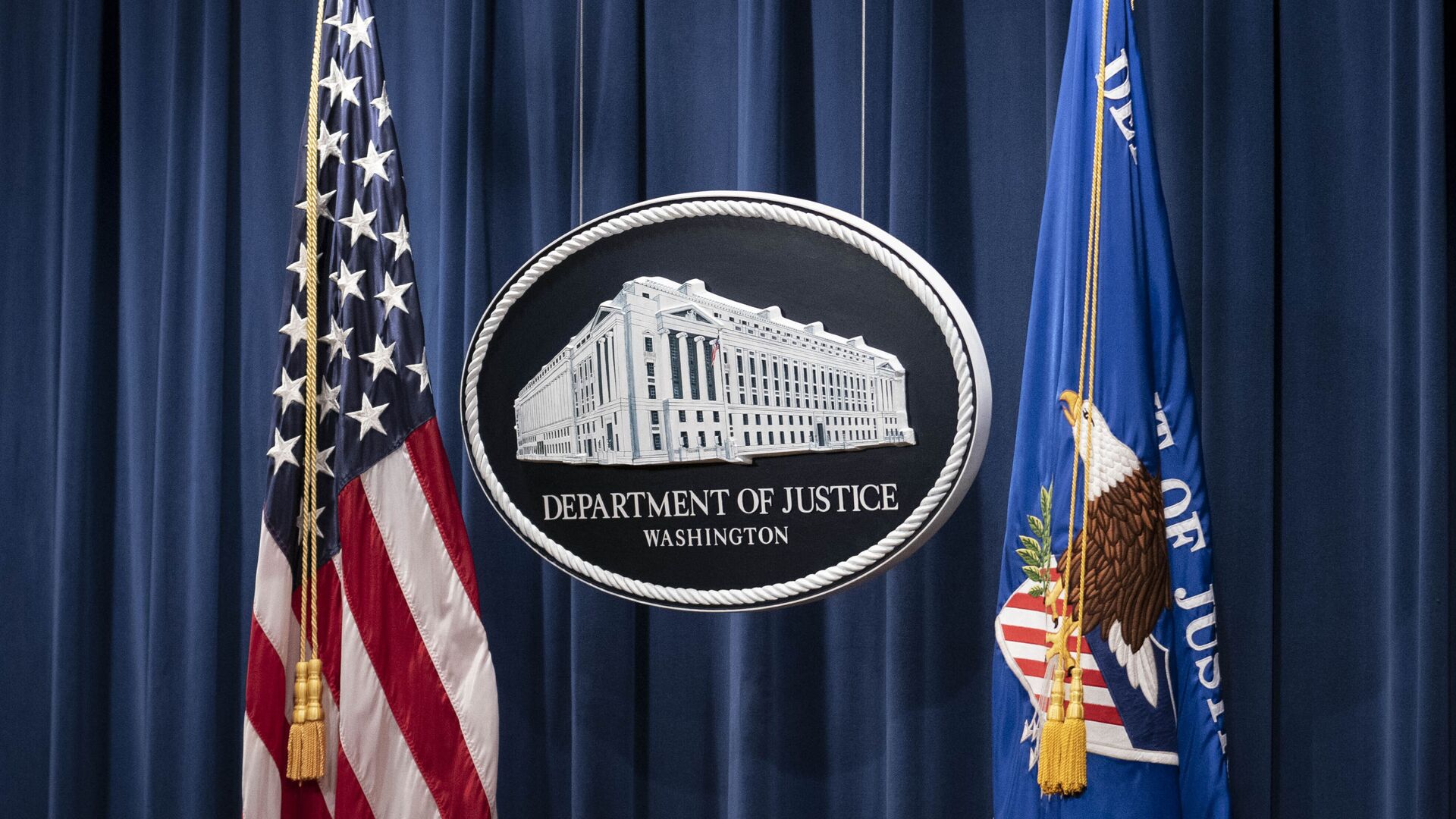 A sign for the Department of Justice is seen ahead of a news conference Tuesday, Jan. 12, 2021, in Washington.  - Sputnik International, 1920, 03.03.2021