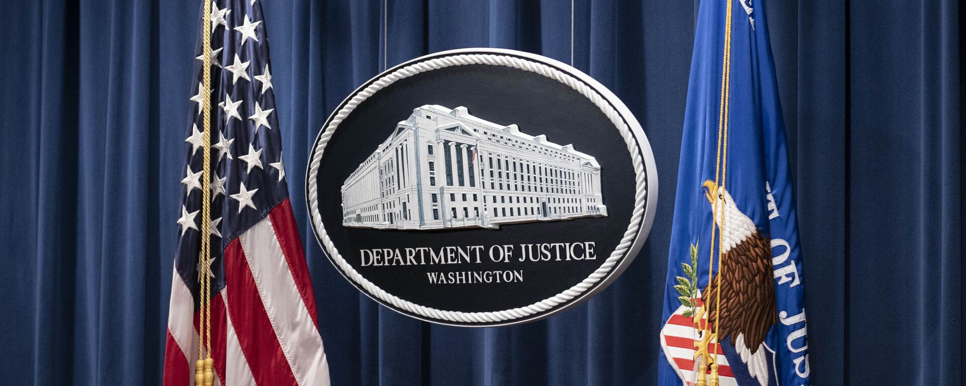A sign for the Department of Justice is seen ahead of a news conference Tuesday, Jan. 12, 2021, in Washington.  - Sputnik International, 1920, 26.04.2022