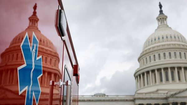 The U.S. Capitol Building is reflected against an ambulance along the East Front on Capitol Hill in Washington, U.S., July 16, 2020 - Sputnik International
