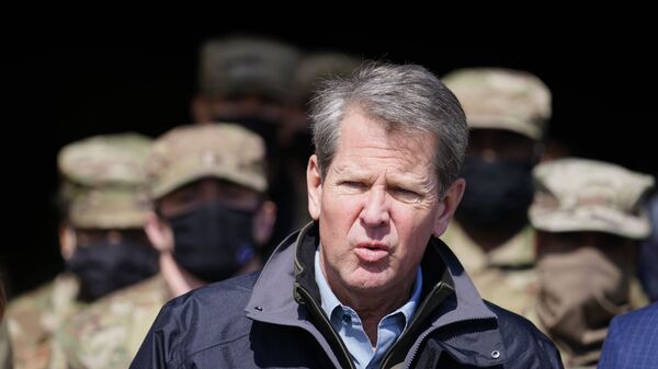 Georgia Gov. Brian Kemp speaks to reporters after touring a mass vaccination site at the Macon State Farmers Market on Friday, Feb. 19, 2021, in Atlanta. - Sputnik International