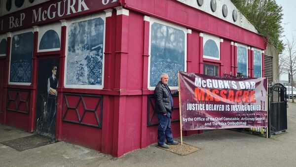 Campaigners stand outside the derelict McGurk's Bar in Belfast - Sputnik International