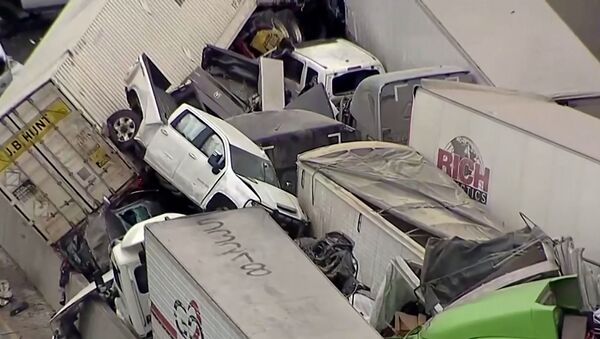 Cars and trucks are wedged together after a morning crash on the ice covered I-35 in Fort Worth - Sputnik International