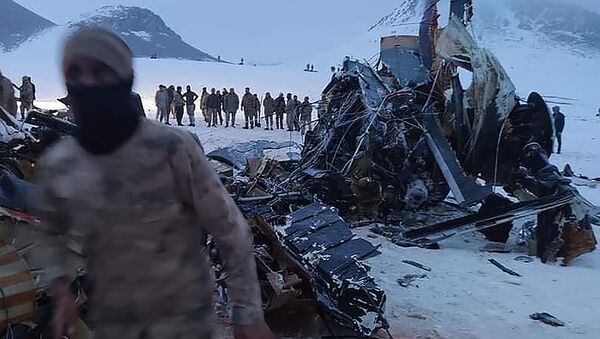 Soldiers and rescue workers stand around the wreckage after an army helicopter crashed in Bitlis, eastern Turkey, Thursday March 4, 2021 - Sputnik International