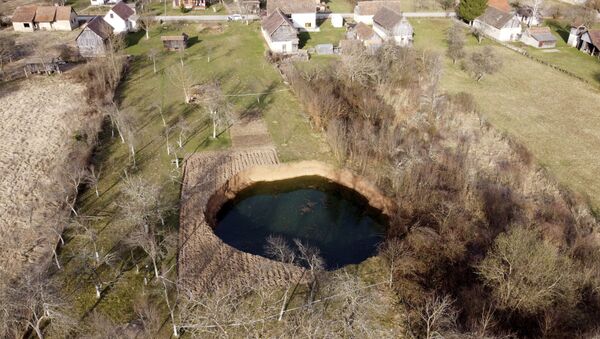 This aerial photo shows a sinkhole in the village of Mececani, central Croatia, Thursday, March 4, 2021 - Sputnik International