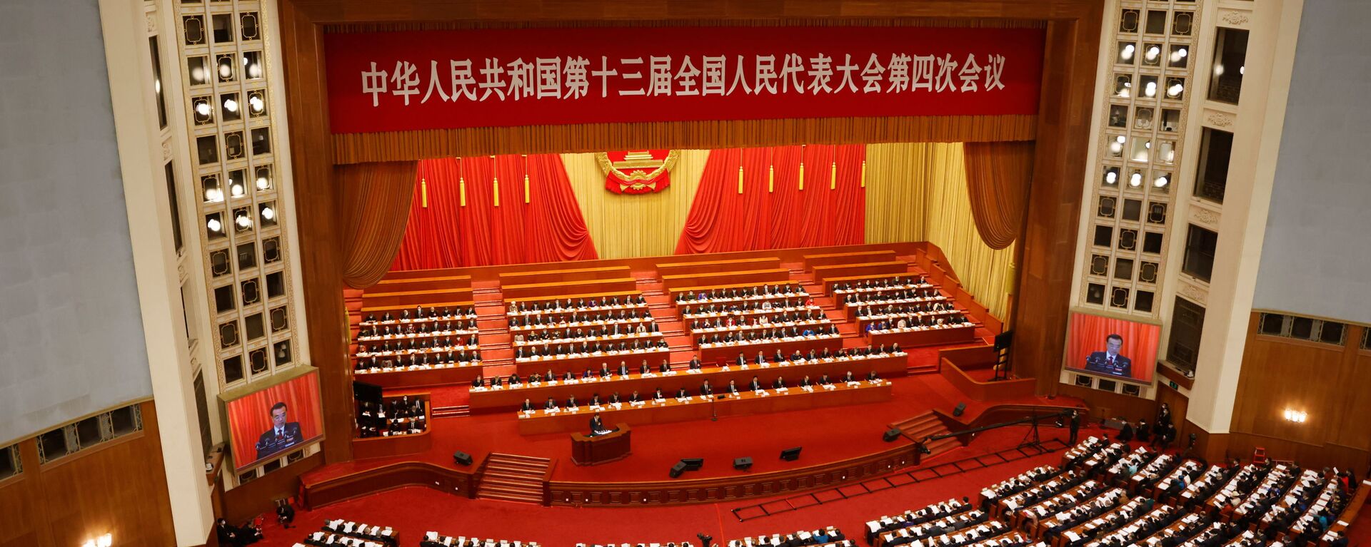 Chinese Premier Li Keqiang speaks at the opening session of the National People's Congress (NPC) at the Great Hall of the People in Beijing, China March 5, 2021. - Sputnik International, 1920, 05.03.2021