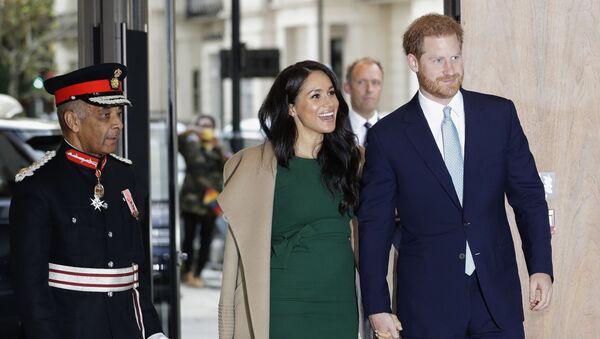 In this 15 October 2019 file photo, Britain's Prince Harry and Meghan, the Duke and Duchess of Sussex, arrive to attend the WellChild Awards Ceremony in London - Sputnik International