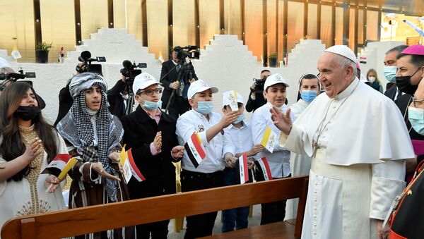 Pope Francis greets people as he arrives to hold a Mass at the Chaldean Cathedral of Saint Joseph in Baghdad, Iraq March 6, 2021.  - Sputnik International