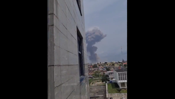 A screenshot from the video allegedly showing the smoke coming from the site of the explosion in Ecuatorial Guinea's city of Bata, posted on Twitter on March 7, 2021 - Sputnik International