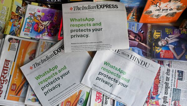 An advertisement from WhatsApp is seen in a newspaper at a stall in New Delhi on January 13, 2021 - Sputnik International
