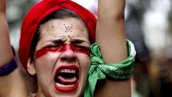 A woman shouts slogans as she marches to Congress to commemorate International Women's Day in Buenos Aires, Argentina, Monday, March 9, 2020.  - Sputnik International
