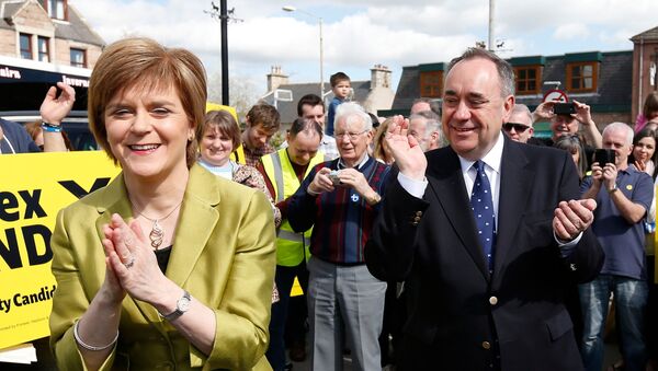 FILE PHOTO: The leader of the Scottish National Party (SNP) Nicola Sturgeon is applauded by former leader and local candidate Alex Salmond during campaigning in Inverurie, Aberdeenshire - Sputnik International