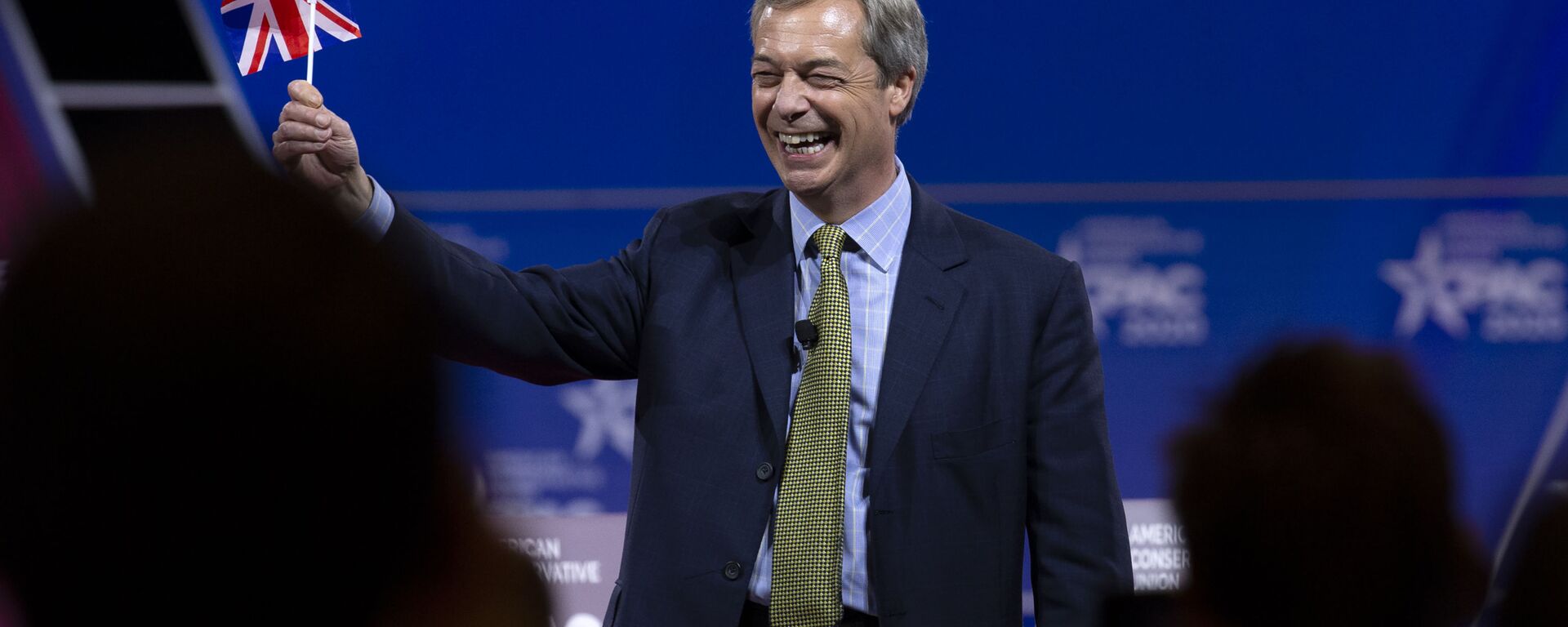 Leader of the Brexit Party and former Member of the European Parliament (MEP) Nigel Farage waves a British flag as he speaks during Conservative Political Action Conference, CPAC 2020, at the National Harbor, in Oxon Hill, Md., Friday, Feb. 28, 2020. - Sputnik International, 1920, 05.07.2024