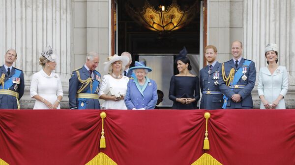 (L-R) Britain's Prince Edward, Earl of Wessex, Britain's Sophie, Countess of Wessex, Britain's Prince Charles, Prince of Wales, Britain's Camilla, Duchess of Cornwall, Britain's Queen Elizabeth II, Britain's Meghan, Duchess of Sussex, Britain's Prince Harry, Duke of Sussex, Britain's Prince William, Duke of Cambridge and Britain's Catherine, Duchess of Cambridge stand on the balcony of Buckingham Palace on July 10, 2018 to watch a military fly-past to mark the centenary of the Royal Air Force (RAF). - Sputnik International