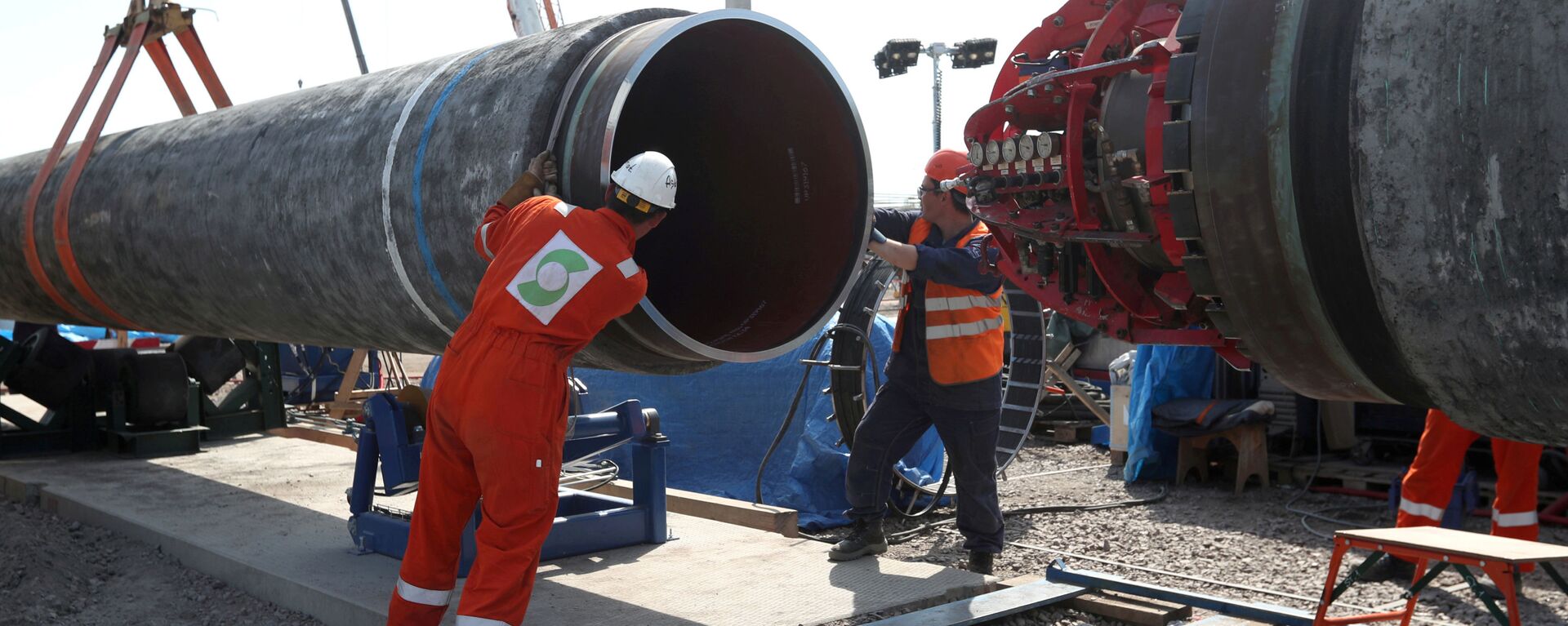 FILE PHOTO: FILE PHOTO: Workers are seen at the construction site of the Nord Stream 2 gas pipeline, near the town of Kingisepp, Leningrad region, Russia, 5 June 2019 - Sputnik International, 1920, 13.03.2021