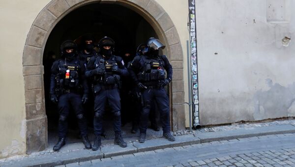Riot police officers wait during a protest against the Czech government's restrictions at the Old Town Square, as the spread of the coronavirus disease (COVID-19) continues in Prague, Czech Republic, March 7, 2021 - Sputnik International