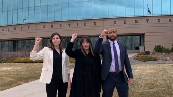 Activists Lillian House, Joel Northam and Eliza Lucero head to a pretrial hearing in Aurora, Colorado, for charges stemming from a July 2020 Black Lives Matter protest - Sputnik International