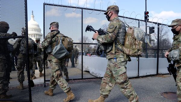 FILE PHOTO: National Guard soldiers patrol the grounds of the US Capitol after police warned that a militia group might try to attack the Capitol complex in Washington, DC, 4 March 2021. - Sputnik International