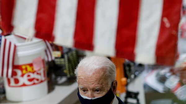 U.S. President Joe Biden walks through W.S. Jenks & Son hardware store as he visits the small business that has benefited from the Paycheck Protection Program, which provides forgivable loans to businesses negatively impacted by the coronavirus disease (COVID-19) pandemic, in Washington, U.S., March 9, 2021 - Sputnik International