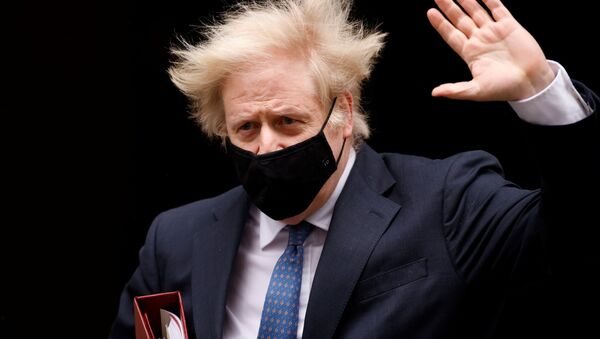 Britain's Prime Minister Boris Johnson gestures outside Downing Street in London, Britain, March 10, 2021 - Sputnik International
